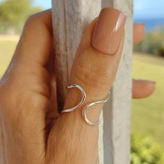 A funky and cool organic shape hammered sterling silver thumb ring.  You can wear this ring on any finger as it is adjustable to one or two sizes larger, not smaller. I love the irregular shape that has an effortless look and uniqueness. You can wear the open side front or back as you prefer.   As with any handmade item, I will try to make all of them very similar, but please allow for slight differences.🤗 This ring will ship within a few days after you place the order and an email notification with the tracking number will be sent. Thank you for supporting my Etsy shop rossanajewelrydesign.etsy.com🌺 Boho Thumb Rings, Sterling Silver Thumb Rings, Thumb Rings Silver, Summer Rings, Hammered Sterling Silver, Thumb Rings, Organic Shapes, Rings Statement, Statement Rings