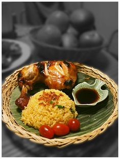 a plate with rice, meat and vegetables on it next to other foods in bowls