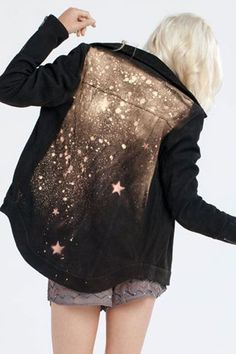 the back of a woman's jacket with stars on it