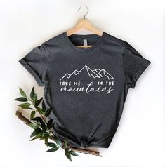 Mountains Trip Shirt,Outdoor Hiking Tee, Adventurer Gift, Take Me To The Mountains Tshirt, Wanderlust Shirt, Camping Squad,Nature Lover Tee HOW TO ORDER 1. From the two Drop-down menus select the Size and the Shirt Color you need. 2. Add these to your cart. *You will need to return to the listing to add the other sizes and designs you need before checking out. 3. After adding all the shirts to the Cart, Checkout them together. DELIVERY & RETURN Order Processing time for Dispatch: 1 working days. ORDER CANCELLATIONS We accept cancellations within 6 hours of placing the order. You can message or email us from your seller account to request cancellation. RETURNS & EXCHANGES Because of the nature of these items, unless they arrive damaged or defective, we can't accept returns for personalized Take Me To The Mountains, Hiking Tshirt, Adventure Gifts, Mountain Tshirt, Mountain Travel, To The Mountains, Travel Shirts, Outdoor Hiking, Shirt Color