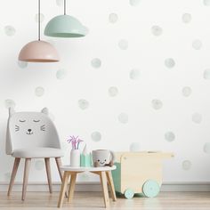 a child's room with polka dots on the wall