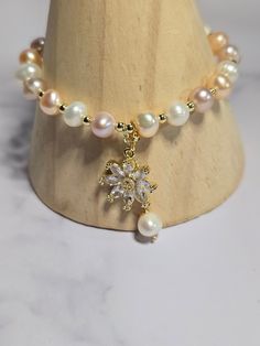 *We all need some simple elegance in our lives and this bracelet is simply elegant.  *This bracelet is made with colorful, real freshwater pearls, gold plated charm, and adjustable gold plated band. Real Pearl Bracelet, Real Pearls, Simple Elegance, Adjustable Bracelet, Pearl Bracelet, Freshwater Pearls, Gold Plate, Jewelry Bracelets, Bracelet