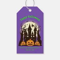 a purple halloween gift tag with an image of a castle and pumpkins on it