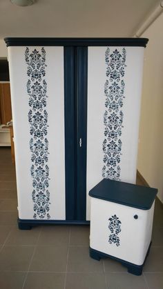 two white and blue storage cabinets in a room