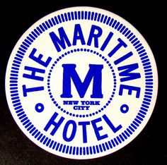 a white and blue sticker that says the maritime hotel on it's side