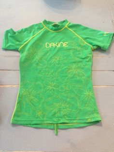 Dakine Junior Swim Shirt Size Large Girl's. Perfect for surfer or someone who wants protection from the sun (UV 40). Gently washed in smoke free home. Green Short Sleeve Swimwear For Spring, Green Short Sleeve Swimwear For Summer, Swim Shorts Aesthetic, Surfing Swim Shorts, Green Short Sleeve Beachwear Top, Y2k Swim Shorts, Swim Shirts Swimmers, Swim Tee Shirts, Surfer Shorts