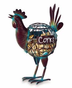 a metal rooster holding a cage filled with coins and eggs that says corb's