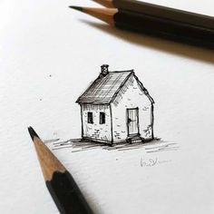 a pencil drawing of a small house on paper