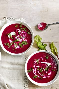 two bowls of beet soup on a table