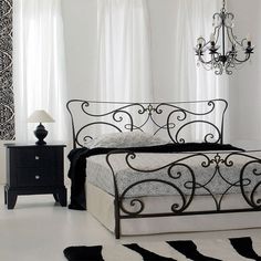 a black and white bedroom with a chandelier