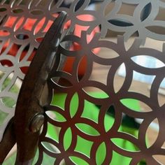 a close up of a metal screen with circles on it