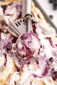 a scoop of ice cream with blueberries in it