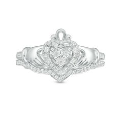 Shimmering with heritage, this diamond Claddagh bridal set is a timeless choice. Crafted in sterling silver, the engagement ring showcases a sparkling diamond-touched heart, hands and crown design with additional diamonds along the shank. On your wedding day, a coordinating diamond-lined chevron wedding band completes the look. Radiant with 1/5 ct. t.w. of diamonds and a bright polished shine, this bridal set expresses your love. Custom-made to fit her ring size. Sterling silver rings cannot be resized after purchase. Claddagh Engagement Ring, Chevron Wedding Band, Zales Engagement Rings, Chevron Wedding, Her Ring, Bridal Engagement Rings, Crown Design, Dream Engagement Rings, Heart Hands