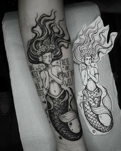 two mermaid tattoos on both arms and legs, one is holding a fish while the other has