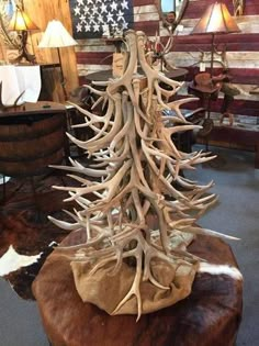 a christmas tree made out of antlers in a store