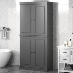 a white bath tub sitting next to a tall gray cabinet