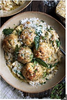 two plates filled with meatballs and rice on top of a table next to bread