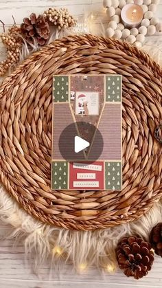 a basket filled with pine cones and other items on top of a white wooden table