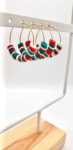 These multicolored holiday themed handmade hoop earrings are lightweight and come in a variety of hoop styles, color designs, and sizes. I use heishi beads which are made of soft polymer clay that is smooth, lightweight, and waterproof. Clay Bead Earrings, Diy Christmas Earrings, Christmas Jewelry Diy, Preppy Bracelets, Handmade Hoop Earrings, Edgy Jewelry, Christmas Clay, Clay Bracelet, Beaded Jewels