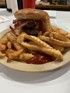 a hamburger and french fries on a plate