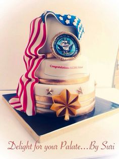 there is a cake made to look like it has an american flag and medal on top