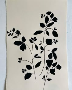 a black and white drawing of flowers on a piece of paper