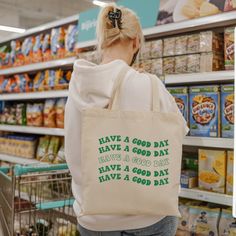 "Say no to plastic with this trendy aesthetic tote bag. Designed to make you look cute while helping the earth, this canvas tote bag is perfect for your next trip to the grocery store, mall, beach, or library.  The details: -100% cotton sheeting -Reinforced handle stitching  -15.75\" H x 15.25\" W -Handle is 21.5\" in length  -       Printed in the USA" Canvas Tote Bag Outfit, Gifts For Teenage Girls, Tote Bag Outfit, Tote Bag Aesthetic, Bag Aesthetic, Sustainable Shopping, Trendy Tote Bags, Trendy Aesthetic