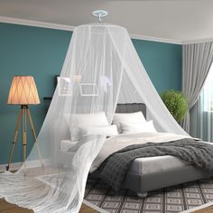 a bed with a white net hanging over it's headboard and foot board