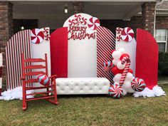 an outdoor christmas display with candy canes, snowmen and santa's sleigh