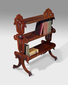 a wooden book shelf with books on it