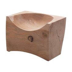 a wooden object that is shaped like a bowl