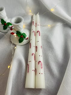 Candy Cane Design Pair of Hand Painted Taper Candles in either 10" or 6" size (unscented) Christmas Holiday/Winter/Fun Design Pillar candles also available. Description: 10" White or Ivory Taper Candles Unscented - Sold in Pairs. 3" x 6" Pillar also available - White or Ivory Unscented - Sold Individually. I do not make the candles.  I paint my design onto the candles. Decorative candles - if candles are going to be burned, it is important to keep the wick trimmed to 1/4" at all times for best results.  Never leave unattended. Candle holders not included.  (Sold Separately) Please let me know if you have any questions. Thanks for viewing ♥ Christmas Candles Painting, Christmas Painted Candles, Candles Painting, Painted Taper Candles, Candle Painting, Thrifting Ideas, Painting Winter, Decorative Candles, Easy Christmas Decorations