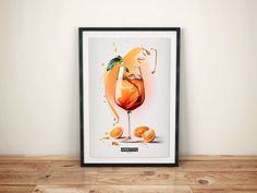 a framed poster with an orange drink on it