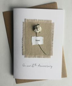 a card with a white rose on it and the words, one end all anniversary