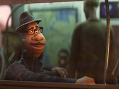 an animated man wearing glasses and a hat sitting in front of a window next to a statue