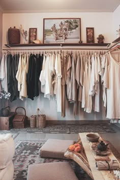 a living room filled with lots of clothes