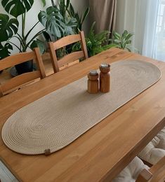 the table is set with two salt and pepper shakers, along with some potted plants