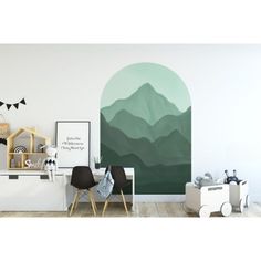 a room with mountains painted on the wall