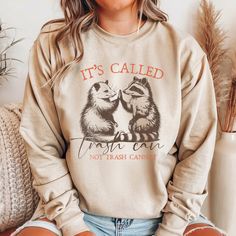 Stay cozy and stylish with our raccoon opossum crewneck sweatshirt! This trash panda shirt is not only funny but also spreads an important message about mental health with the "It's Trashcan Not Cannot" slogan. Perfect for raccoon lovers and those who enjoy a good meme sweatshirt, this funny raccoon shirt is a must-have addition to your wardrobe. Whether you're looking for a funny animal shirt or a unique gift, our raccoon sweatshirt is the ideal choice. Embrace your love for raccoons and showca Trash Panda Shirt, Aesthetic Crewneck, Funny Animal Shirts, Raccoon Shirt, Raccoon Funny, Business Shirts, Retro Aesthetic, Animal Shirts, Shirt Outfit