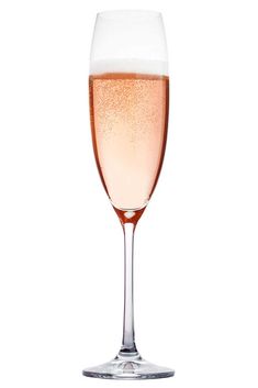 a wine glass filled with champagne on a white background