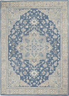 a blue and beige rug with an ornate design