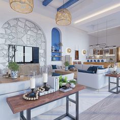 a living room filled with furniture next to a stone wall covered in blue and white