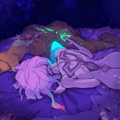 a person laying on top of a bed covered in purple and blue sheets with green lights