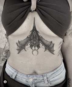 Upside Down Bat Tattoo Sternum, Bat Tattoo Under Breast, Bat Tattoo Stomach, Bat Underbust Tattoo, Bat Wings Back Tattoo, Goth Chest Tattoo Female, Spooky Sternum Tattoo, Bat Chest Tattoo Female, Sternum Bat Tattoo