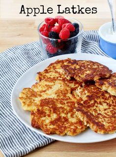 pancakes on a plate with berries and yogurt