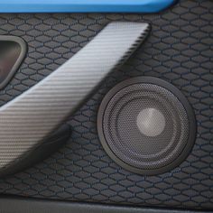 the speaker is sitting on the car floor