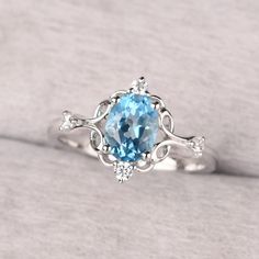 ◆ The ring is handcrafted from sterling silver and decorated with a dazzling 8*6 mm Swiss blue topaz and CZs. It is suitable for engagement/anniversary/daily occasion. ◆ Production Description: Main stone Type: Swiss Blue Topaz Main Stone Shape: Oval Cut Main Stone Size: 8*6 mm(1.47ct) Side stone: CZ Metal: 925 Sterling silver - Other options available in the drop down menu ◆ Customization: √Free for Add Engraving √Other Metal Type Available √Other Gemstones & Shapes Available √Personalization R Silver Rings With Blue Stones, Blue Topaz Wedding Ring Set, Silver And Blue Ring, Light Blue Wedding Rings, Engagement Rings Silver Sapphire, Silver Ring With Blue Stone, Blue Engagement Ring Silver, Engagement Rings Topaz, Light Blue Rings