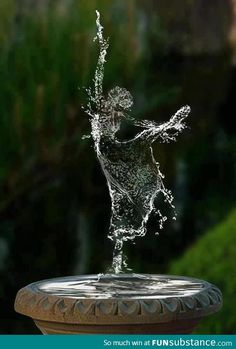 a fountain with water splashing out of it