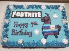 a birthday cake with a blue frosting and an image of a llama