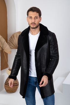 Embrace the winter season in style with our exclusive men's leather parka, meticulously crafted from 100% genuine leather. This coat features a cozy fur-lined interior to keep you warm in the chilliest of weather. With a length of 90 cm (approximately 35.5 inches), it offers ample coverage and insulation. The double-breasted collar design lends a contemporary and sleek aesthetic. Opt for a versatile look with its solid color and biker style, perfect for elevating your streetwear. Experience comf Classic Black Winter Parka, Classic Leather Outerwear For Cold Weather, Classic Black Sheepskin Outerwear, Classic Hooded Leather Jacket For Winter, Hooded Leather Winter Outerwear, Hooded Leather Outerwear For Winter, Hooded Leather Outerwear With Faux Fur Lining, Hooded Leather Jacket With Faux Fur Lining, Classic Winter Leather Jacket With Faux Fur Lining